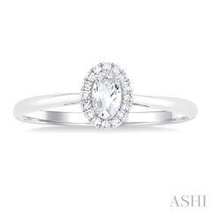 5x3 MM Oval Shape White Topaz and 1/20 Ctw Single Cut Diamond Halo Semi-Precious Ring in 14K White Gold 5x3 MM Oval Shape White Topaz and 1/20 Ctw Single Cut Diamond Halo Semi-Precious Ring in 14K White Gold