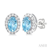 5x3 MM Oval Shape Aquamarine and 1/8 Ctw Round Cut Diamond Halo Semi-Precious Stud Earrings in 14K White Gold