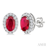 5x3 MM Oval Shape Ruby and 1/8 Ctw Round Cut Diamond Halo Precious Stud Earrings in 14K White Gold