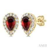 5x3 MM Pear Shape Garnet and 1/8 Ctw Single Cut Diamond Halo Semi-Precious Stud Earrings in 14K Yellow Gold