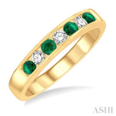 2.5 MM Round Cut Emerald and 1/5 Ctw Channel Set Round Cut Diamond Band in 14K Yellow Gold