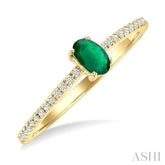 5x3 MM Oval Cut Emerald and 1/10 Ctw Petite Round Cut Diamond Precious Fashion Ring in 10K Yellow Gold