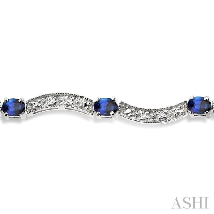 4x3 MM Oval Cut Sapphire and 1/10 Ctw Single Cut Diamond Bracelet in 14K White Gold