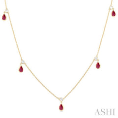 1/8 ctw Round Cut Diamonds and 5X3MM Pear Shape Ruby Precious Station Necklace in 10K Yellow Gold