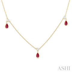 1/8 ctw Round Cut Diamonds and 5X3MM Pear Shape Ruby Precious Station Necklace in 10K Yellow Gold