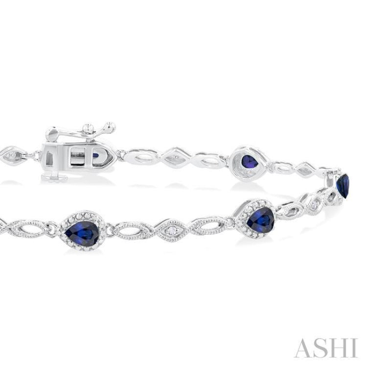 4X3 MM Pear Cut Sapphire and 1/20 Ctw Round Cut Diamond Precious Fashion Bracelet in 10K White Gold