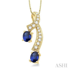 5x4 MM Oval Cut Sapphire and 1/6 ctw Round Cut Diamond Precious Pendant in 14K Yellow Gold with Chain