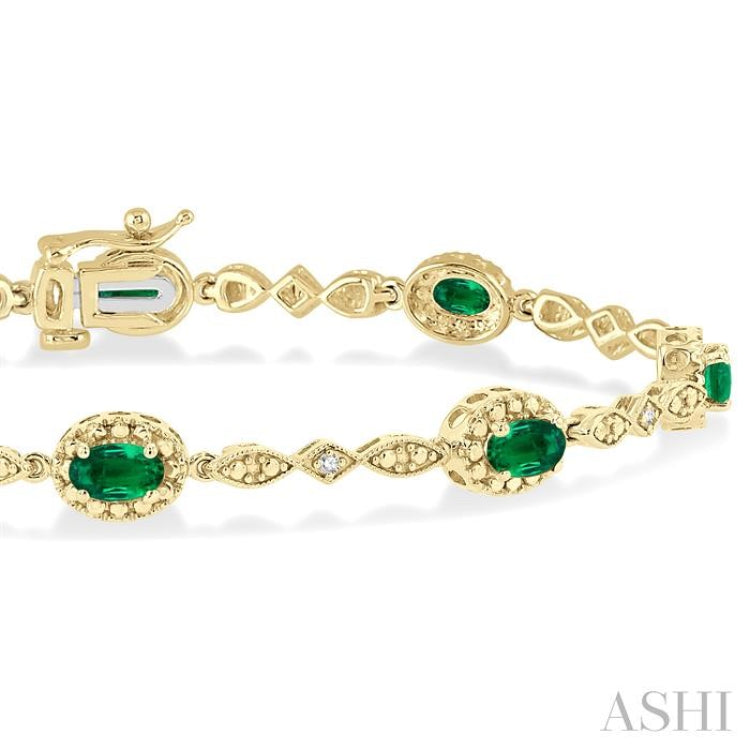 5x3 MM Oval Cut Emerald and 1/20 Ctw Single Cut Diamond Bracelet in 10K Yellow Gold